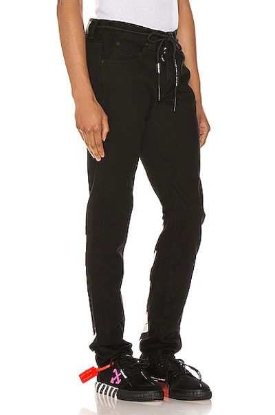 Shop Off-white Diagonal Stripe Slim Jeans In Black