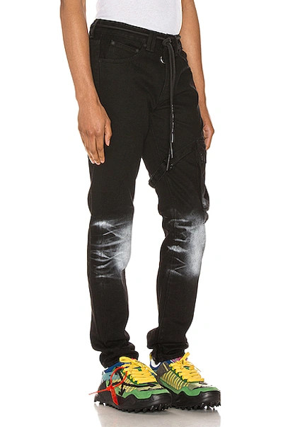 Shop Off-white Slim Asymmetric Jeans In Black