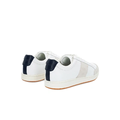 Shop Lacoste Men's Carnaby Sneaker In Off White/navy