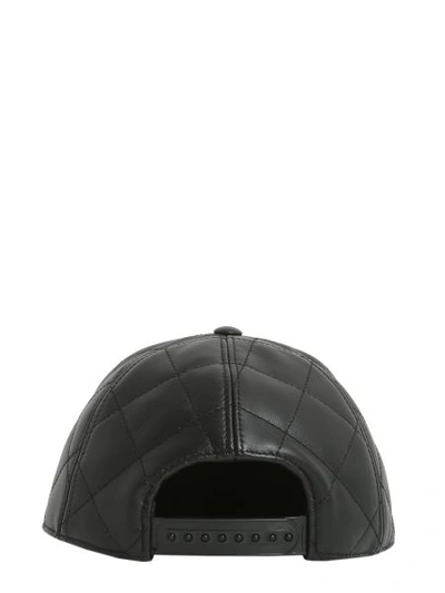 Shop Moschino Quilted Cap In Black