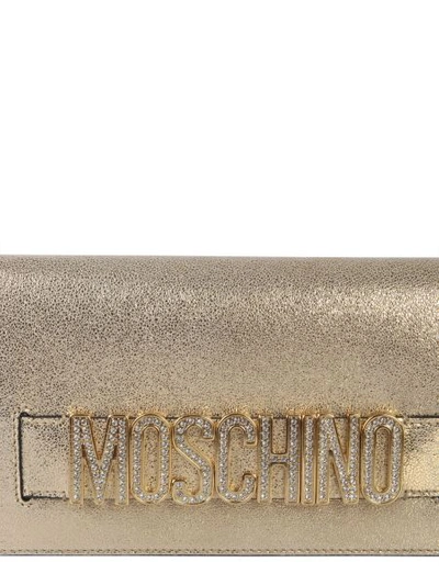 Shop Moschino Clutch With Logo In Gold