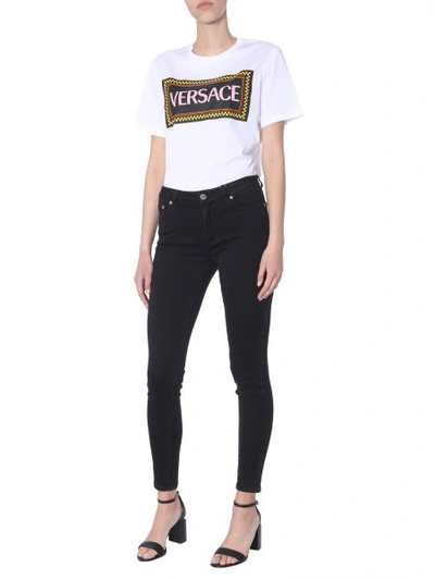 Shop Versace 90s Vintage Logo T-shirt With Wheeled Print In White