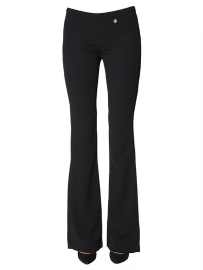 Shop Versace Flare Trousers In Black