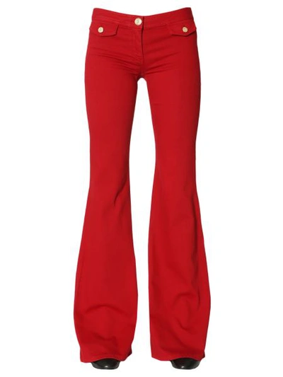 Shop Balmain Denim Stretch Flare Trousers In Red