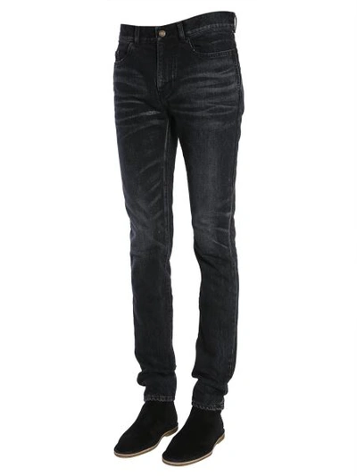 Shop Saint Laurent Low-rise Skinny Jeans In Black