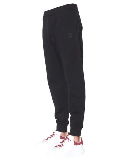 Shop Alexander Mcqueen Jogging Pants With Skull Patches In Black