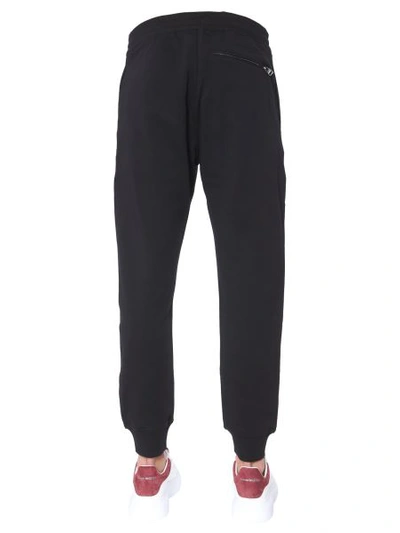 Shop Alexander Mcqueen Jogging Pants With Skull Patches In Black