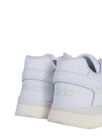 Shop Adidas Originals A.r. Trainer Sneakers In White