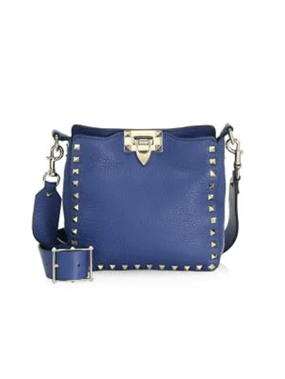 Shop Valentino Garavani Mini Rockstud Leather Hobo Bag In Blue