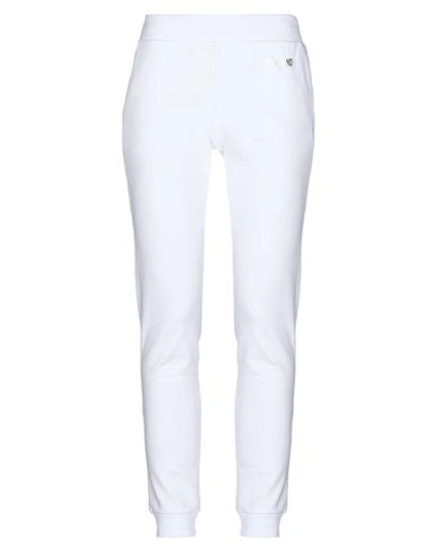 Shop Moschino Pants In White
