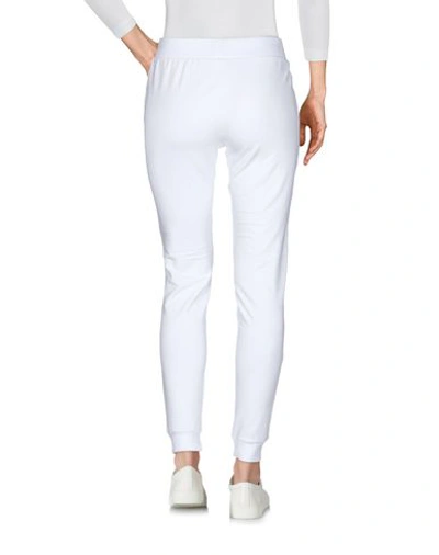 Shop Moschino Pants In White