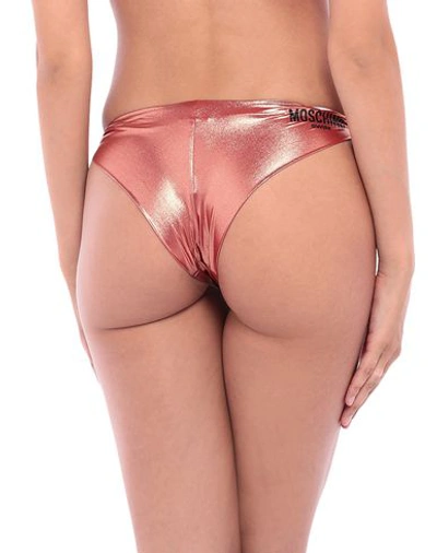 Shop Moschino Bikini Bottoms In Copper