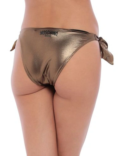 Shop Moschino Bikini Bottoms In Bronze