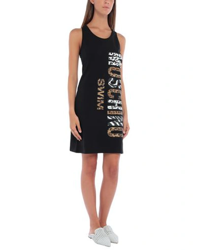Shop Moschino Cover-ups In Black