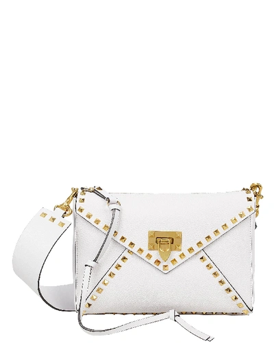 Shop Valentino Garavani Rockstud Hype Envelope Bag In White