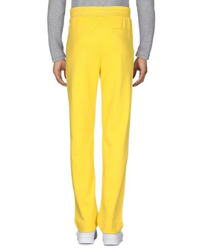 Shop Moschino Man Pants Yellow Size L Cotton