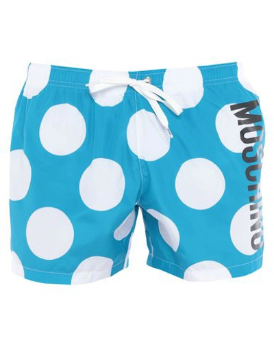 Shop Moschino Swim Trunks In Turquoise