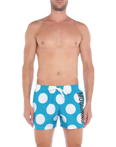 Shop Moschino Swim Trunks In Turquoise