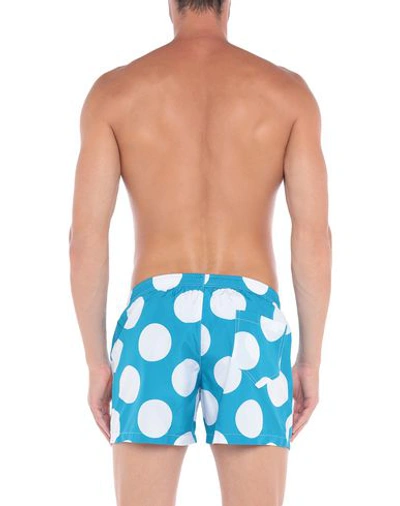 Shop Moschino Swim Trunks In Turquoise