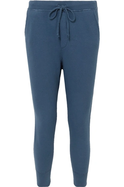 Shop Nili Lotan Nolan Distressed Cotton-jersey Track Pants In Blue