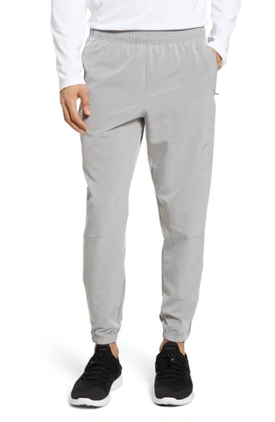 Shop Nike Phantom Essence Athletic Pants In Dark Sky Grey/ Silver