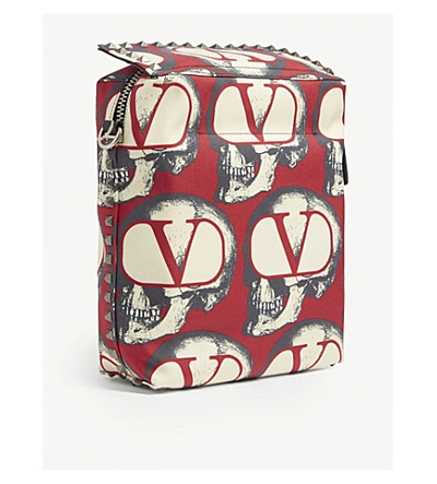 Shop Valentino X Undercover Skull-printed Canvas Messenger Bag In Red