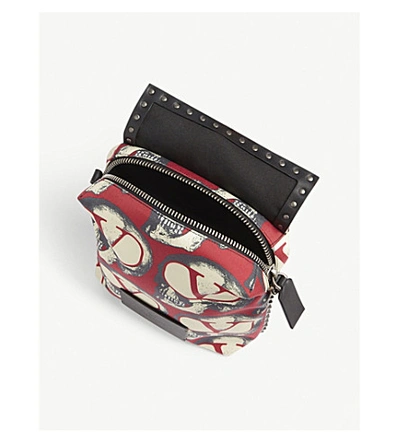 Shop Valentino X Undercover Skull-printed Canvas Messenger Bag In Red