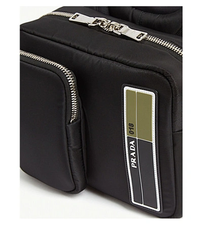 Shop Prada Rubberised-logo Shell Backpack In Black