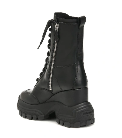 Shop Miu Miu Leather Ankle Boots In Black