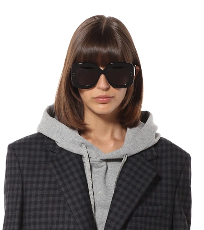 Shop Alaïa Square Sunglasses In Black