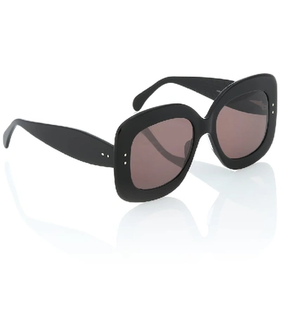 Shop Alaïa Square Sunglasses In Black