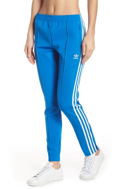 Shop Adidas Originals Adidas Sst Track Pants In Bluebird