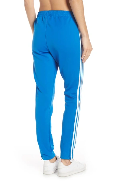 Shop Adidas Originals Adidas Sst Track Pants In Bluebird