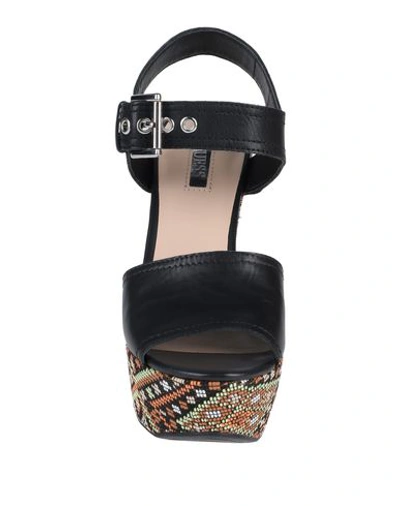 Shop Guess Sandals In Black