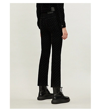 Shop Stella Mccartney Monogram-covered Flared High-rise Velvet Trousers In Black