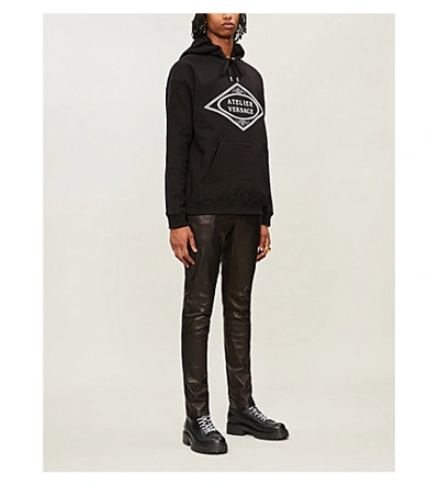Shop Versace Atelier Logo-embroidered Cotton-jersey Hoody In Black
