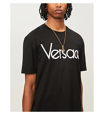 Shop Versace Logo Brand-embroidered Cotton T-shirt In Nero Bianco