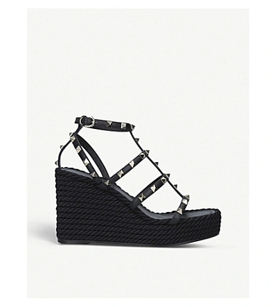 Shop Valentino Rockstud Leather Wedge Sandals In Black