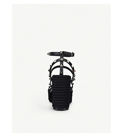 Shop Valentino Rockstud Leather Wedge Sandals In Black