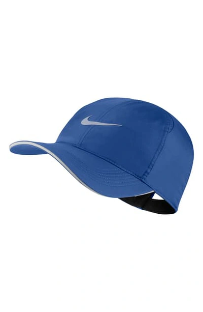 Shop Nike Featherlight Run Cap In Indfrc/refsil