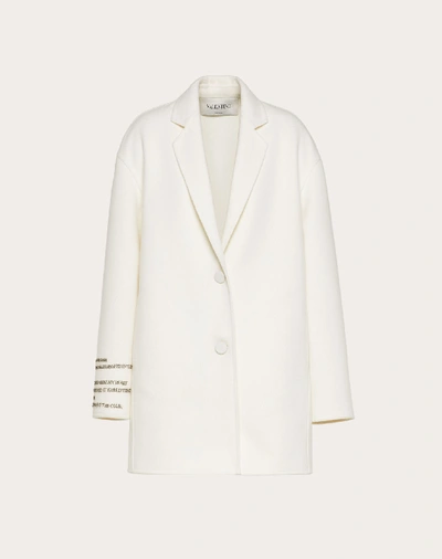 Shop Valentino Compact Drap Coat With Poetry Detailing In Ivory