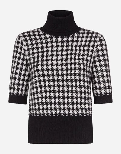 Shop Dolce & Gabbana High Neck Cashmere Houndstooth Sweater In White/black