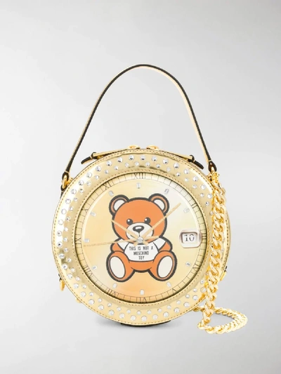 Shop Moschino Round Teddy Bear Bag In Gold