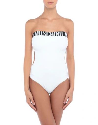 Shop Moschino One-piece Swimsuits In White