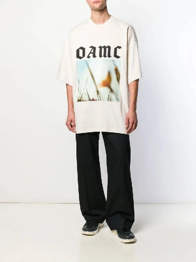 Shop Oamc Over-sized Logo Graphic Print T-shirt In Neutral