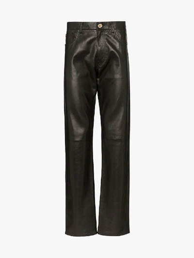 Shop Versace Straight Leg Leather Trousers In Black