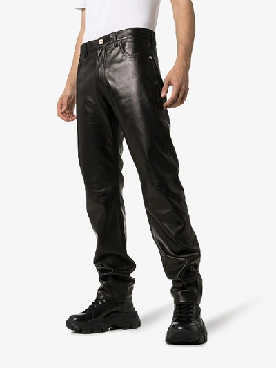 Shop Versace Straight Leg Leather Trousers In Black