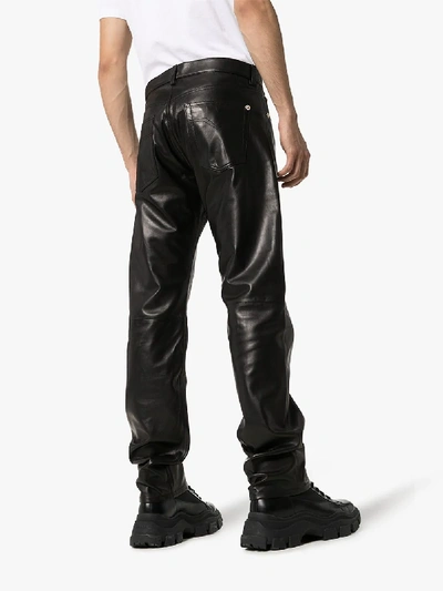 Shop Versace Straight Leg Leather Trousers In Black