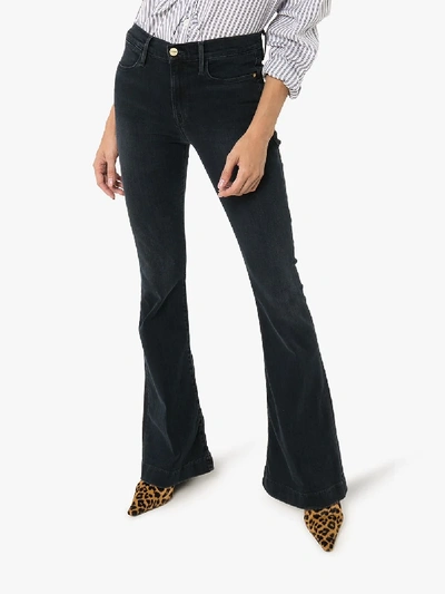 Shop Frame Le High Flared Jeans In Black