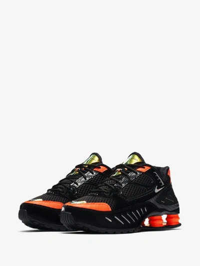 Shop Nike Black And Orange Shox Enigma Sneakers